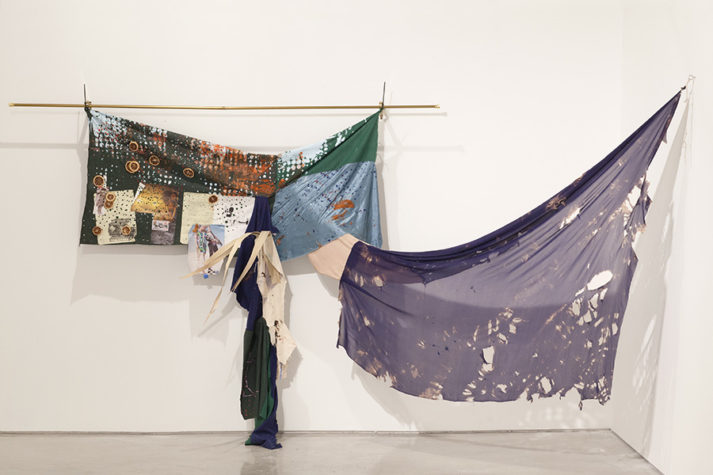 Eric Mack, Claudine, 2014, acrylic on cotton, silk, dried orange slices, palm, legal pad paper, fashion images on a curtain rod, 192 x 72 x 24 inches