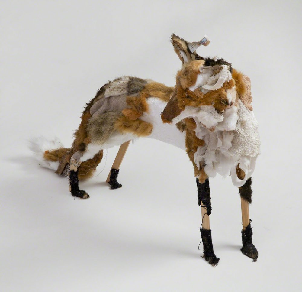 Kathryn Spence, Red Fox and Object, 2011, wood, towels, pants, socks, sweater, skirt lining, toy stuffed bear, dog, fox tiger, Styrofoam, sand, dirt, thread, pins 22 x 26 x 9 inches. Image courtesy of Wirtz Art