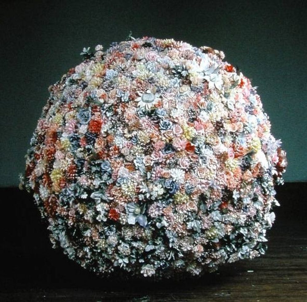D'nell Larson, The Abominable Snowball, 1995, metal frame, artificial flowers, snow flakes. Image courtesy of www.aptglobal.org